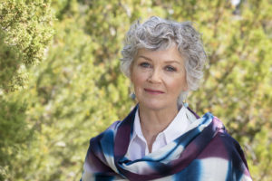 Woman with a gentle smile is wearing a hand-dyed scarfEmotional and spiritual healing offers tranquility, peace, and grace. The Santa Fe Therapist offers online therapy for trauma, depression, anxiety, angst, despair, and stress. Santa Fe NM. 87506, 87048, 87501, 87043