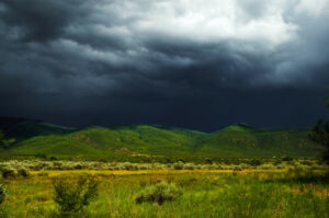 Dark, threatening storm clouds fill New Mexico sky. The disowned parts of yourself can cause intrusive, negative thoughts, catastrophizing, and contribute to anxiety and depression and emotional overwhelm. The Santa Fe Therapist can help you regain your emotional wellbeing. The Santa Fe Therapist is here to help you move into your future. Online therapy in New Mexico. 87506, 87048, 87501, 87505