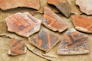 broken Native American pottery shards in northern New Mexico; symbolic for the ways that psychiatry has failed so many people suffering from mental illness. Emotional health and wellbeing are possible. The Santa Fe Therapist Living From Happiness podcast with thought leader Daniel Bergner explores the limitations of biological psychiatry. Online therapy. 87506, 87048, 87544, 87122