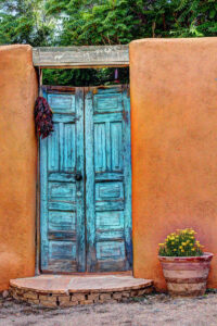 old blue wooden doors in adobe wall, Santa Fe NM, grief counseling, 87505