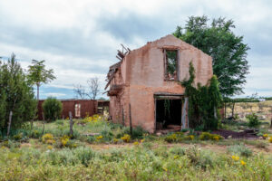 Abandoned adobe house in ruins in New Mexico evokes feelings of lack of emotional safety in relationships. PTSD therapy and CPTSD healing is possible. The Santa Fe Therapist online therapy. 87122, 87506, 87048, 87501